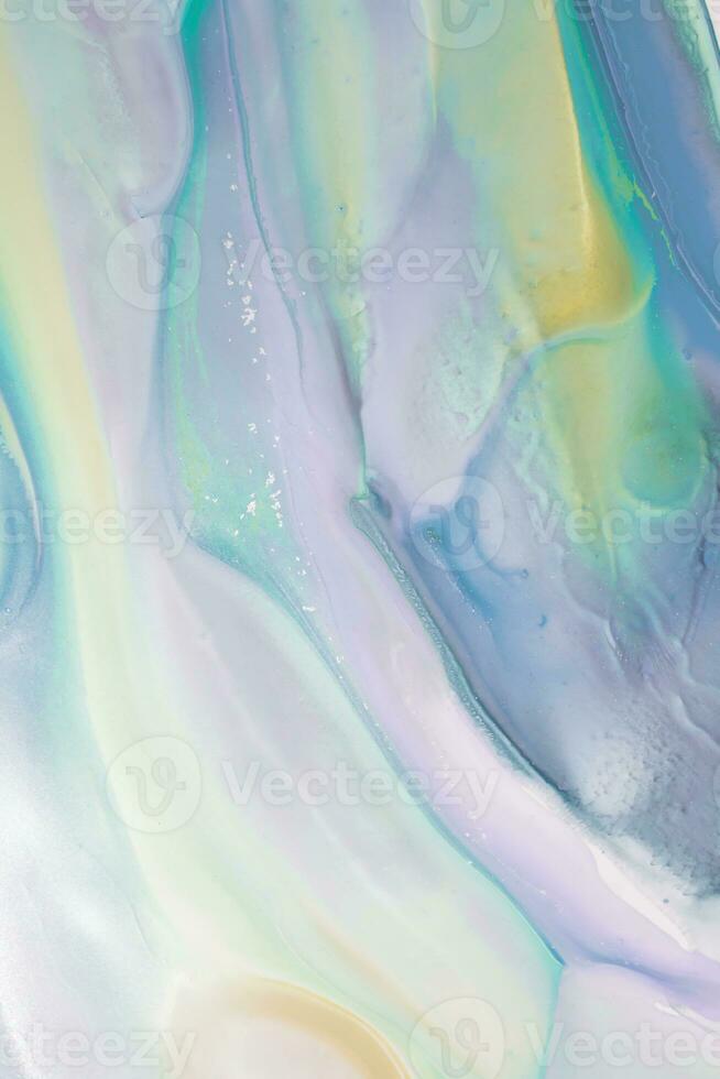 Abstract created using the technique of liquid acrylic. Macro photography of the smallest details of a picture. The picture shows how overflows of shades and colors of paint resemble space motifs. photo