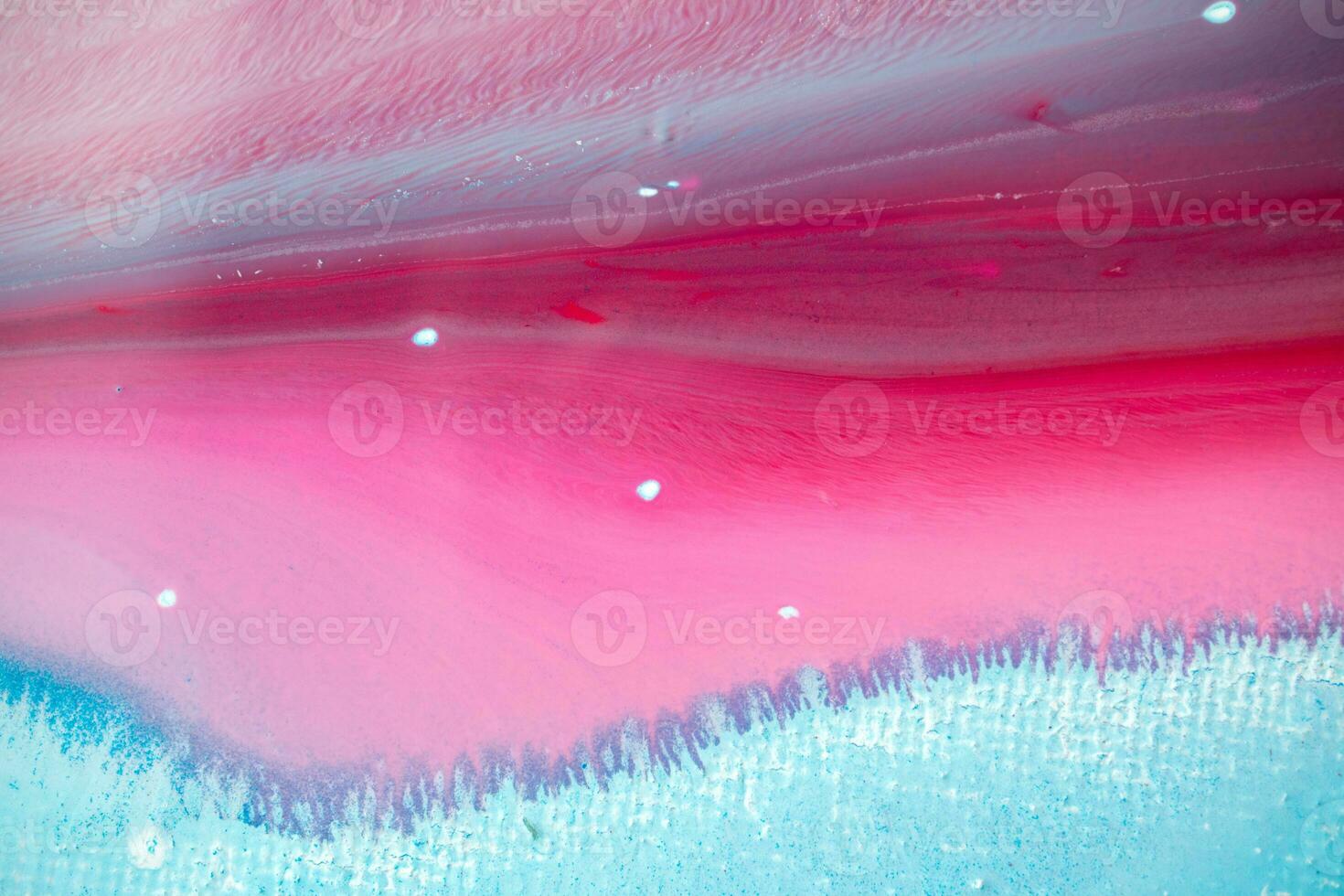 Abstract created using the technique of liquid acrylic. Macro photography of the smallest details of a panting. The panting shows how overflows of shades and colors of paint resemble space motifs. photo