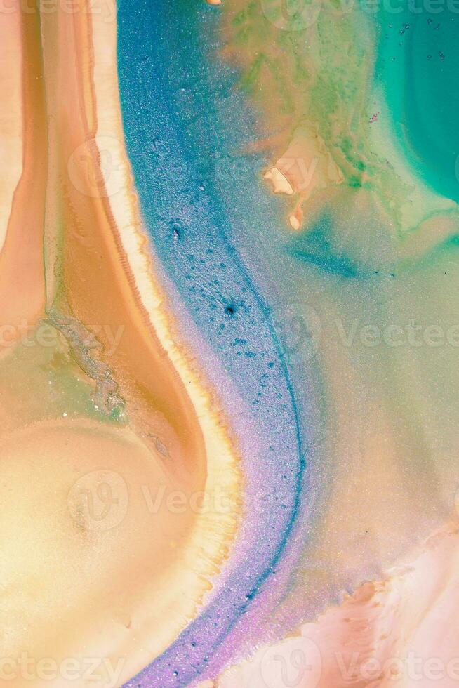 Abstract created using the technique of liquid acrylic. Macro photography of the smallest details of a picture. The picture shows how overflows of shades and colors of paint resemble space motifs. photo