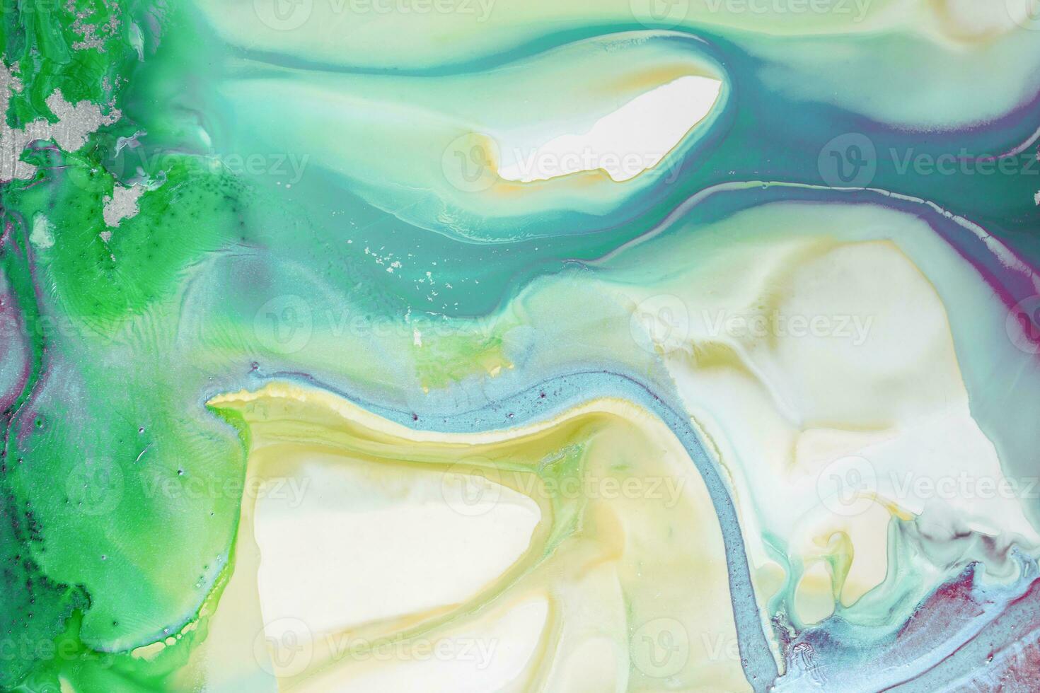 Abstract created using the technique of liquid acrylic. Macro photography of the smallest details of a picture. The picture shows how overflows of shades and colors of paint resemble space motifs. photo