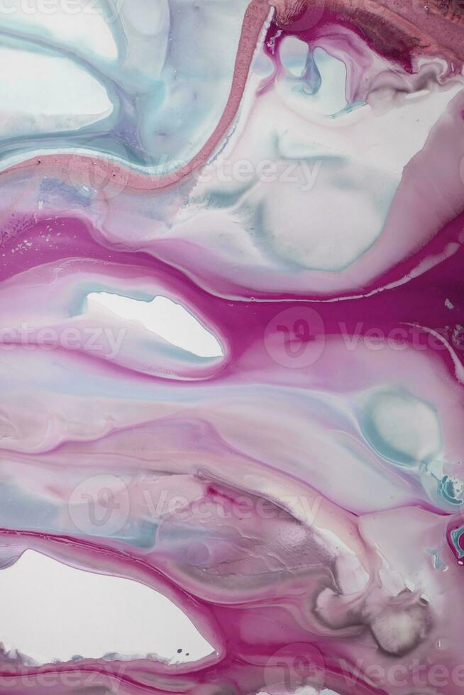 Abstract created using the technique of liquid acrylic. Macro photography of the smallest details of a picture. The picture shows how overflows of shades and colors of paint resemble space motifs. photo