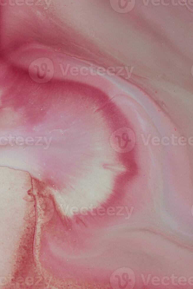 Abstract created using the technique of liquid acrylic. Macro photography of the smallest details of a picture. The picture shows how overflows of shades and colors of paint resemble space motifs. photo