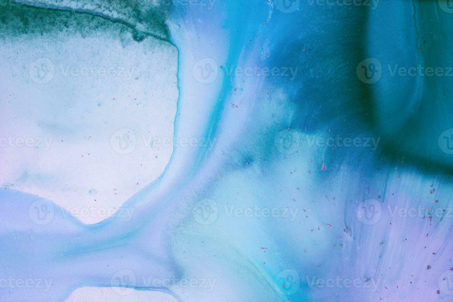 Abstract created using the technique of liquid acrylic. Macro photography of the smallest details of a picture. The picture shows how overflows of shades and colors of paint resemble space motifs. photo