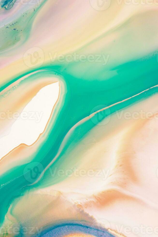 Abstract created using the technique of liquid acrylic. Macro photography of the smallest details of a picture. The picture shows how overflows of shades and colors of paint resemble space motifs. photo