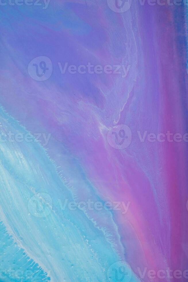Abstract created using the technique of liquid acrylic. Macro photography of the smallest details of a panting. The panting shows how overflows of shades and colors of paint resemble space motifs. photo