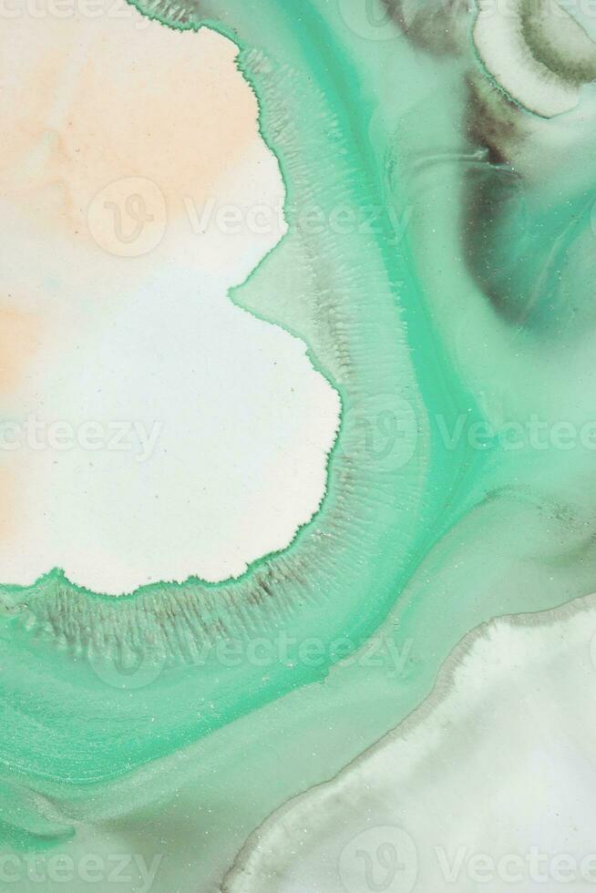 Abstract created using the technique of liquid acrylic. Macro photography of the smallest details of a picture. The picture shows how overflows of shades and colors of paint resemble space motifs. photo