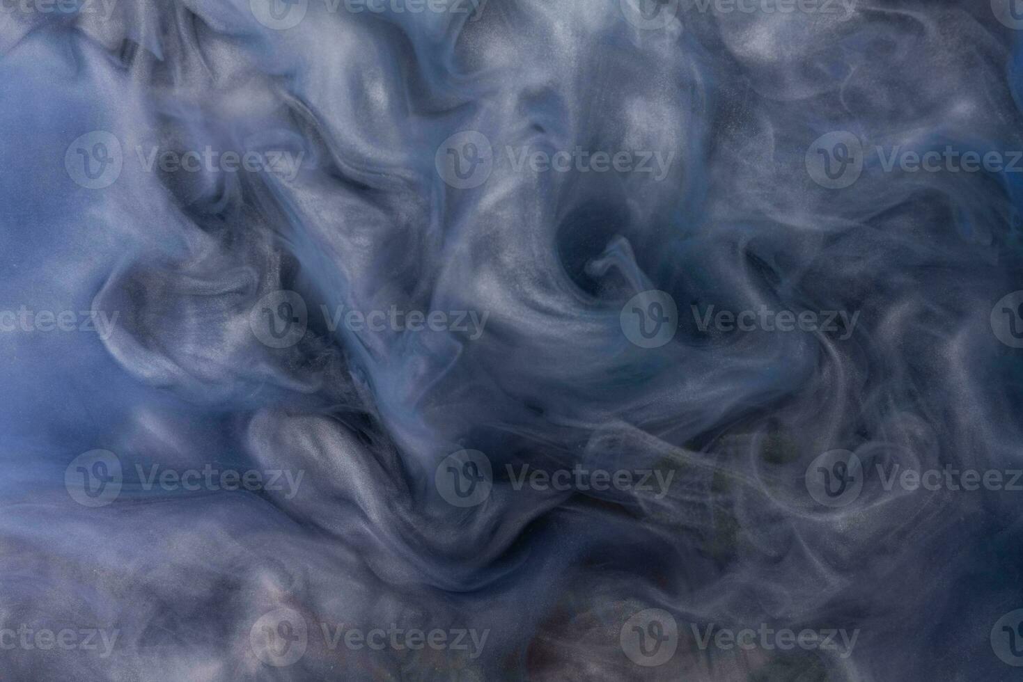 Abstract fluid acrylic painting. Marbled blue and gold abstract Ink cloud on background. Liquid marble pattern. Modern art. photo