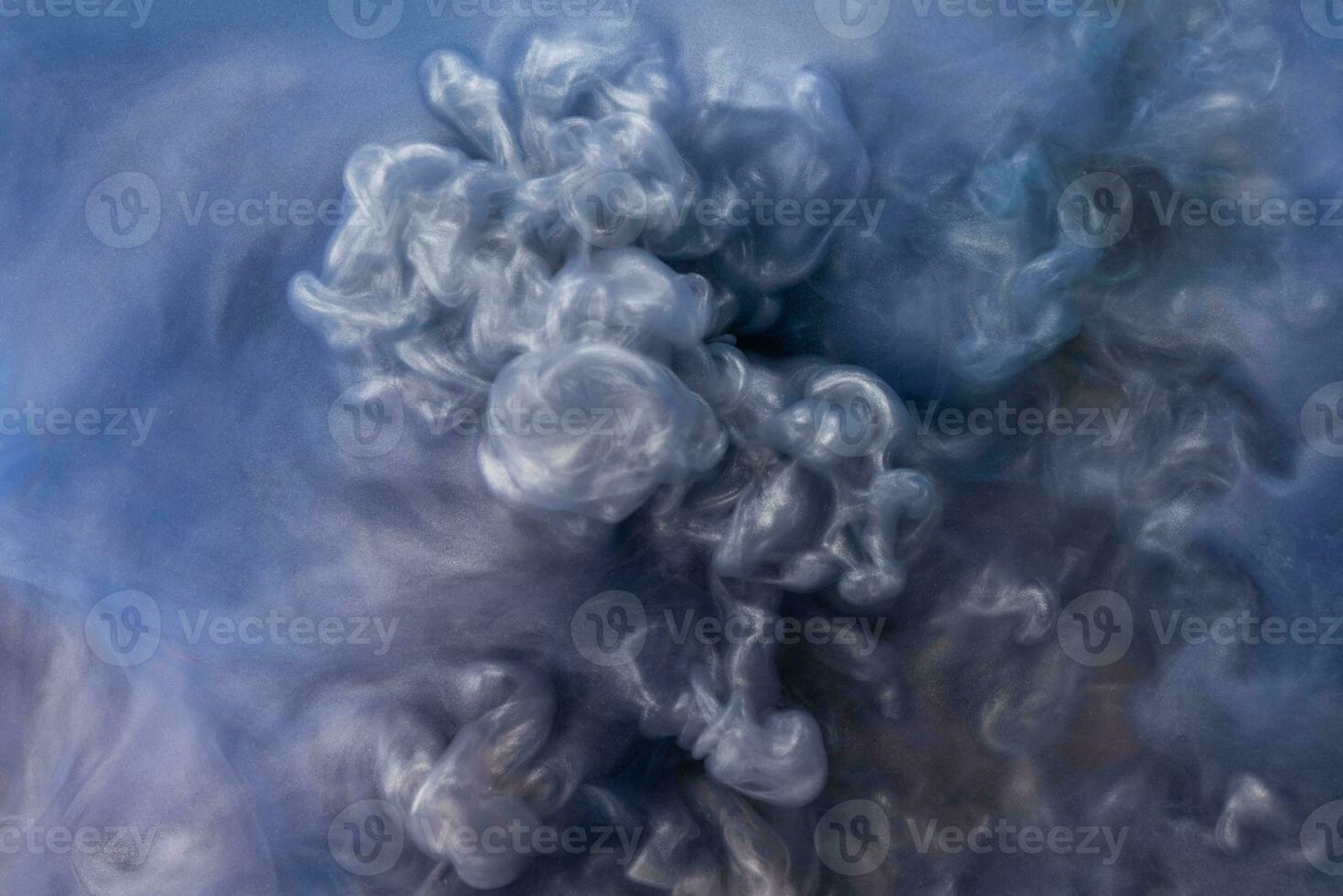 Abstract fluid acrylic painting. Marbled blue and gold abstract Ink cloud on background. Liquid marble pattern. Modern art. photo
