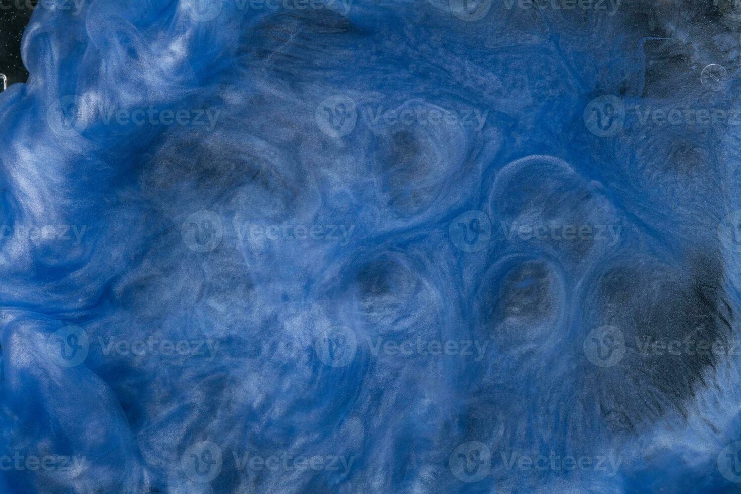 Abstract fluid acrylic painting. Marbled blue and gold abstract Ink cloud on background. Liquid marble pattern. Modern art. photo