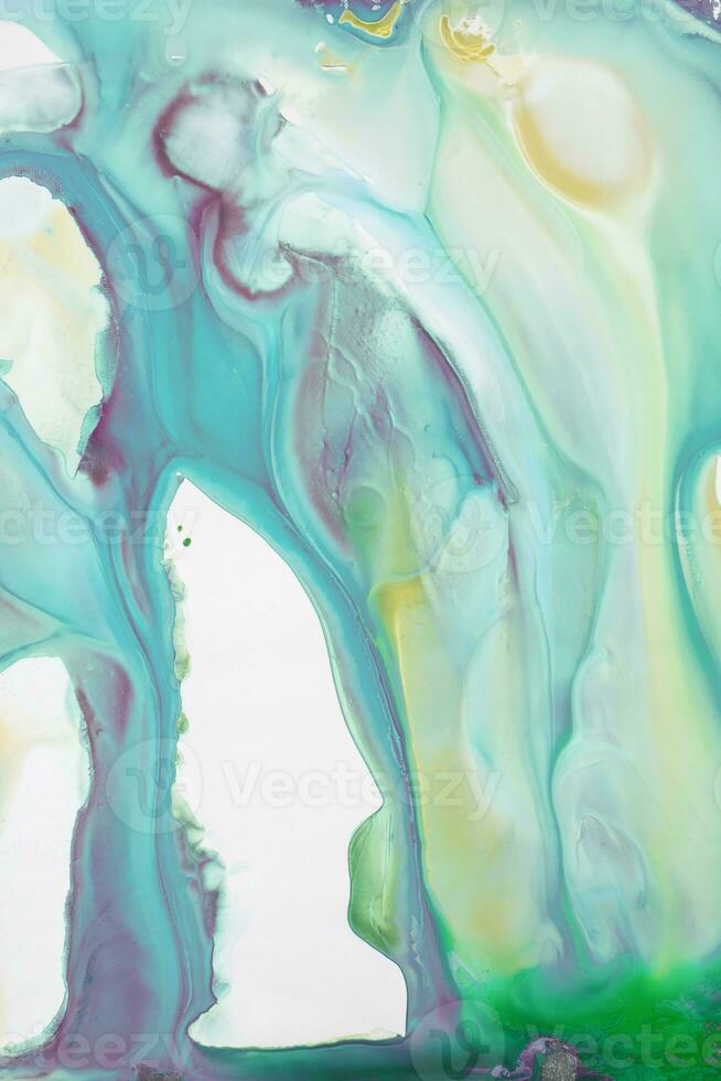 Abstract created using the technique of liquid acrylic. Macro photography of the smallest details of a picture. The picture shows how overflows of shades and colors of paint resemble space motifs. photo