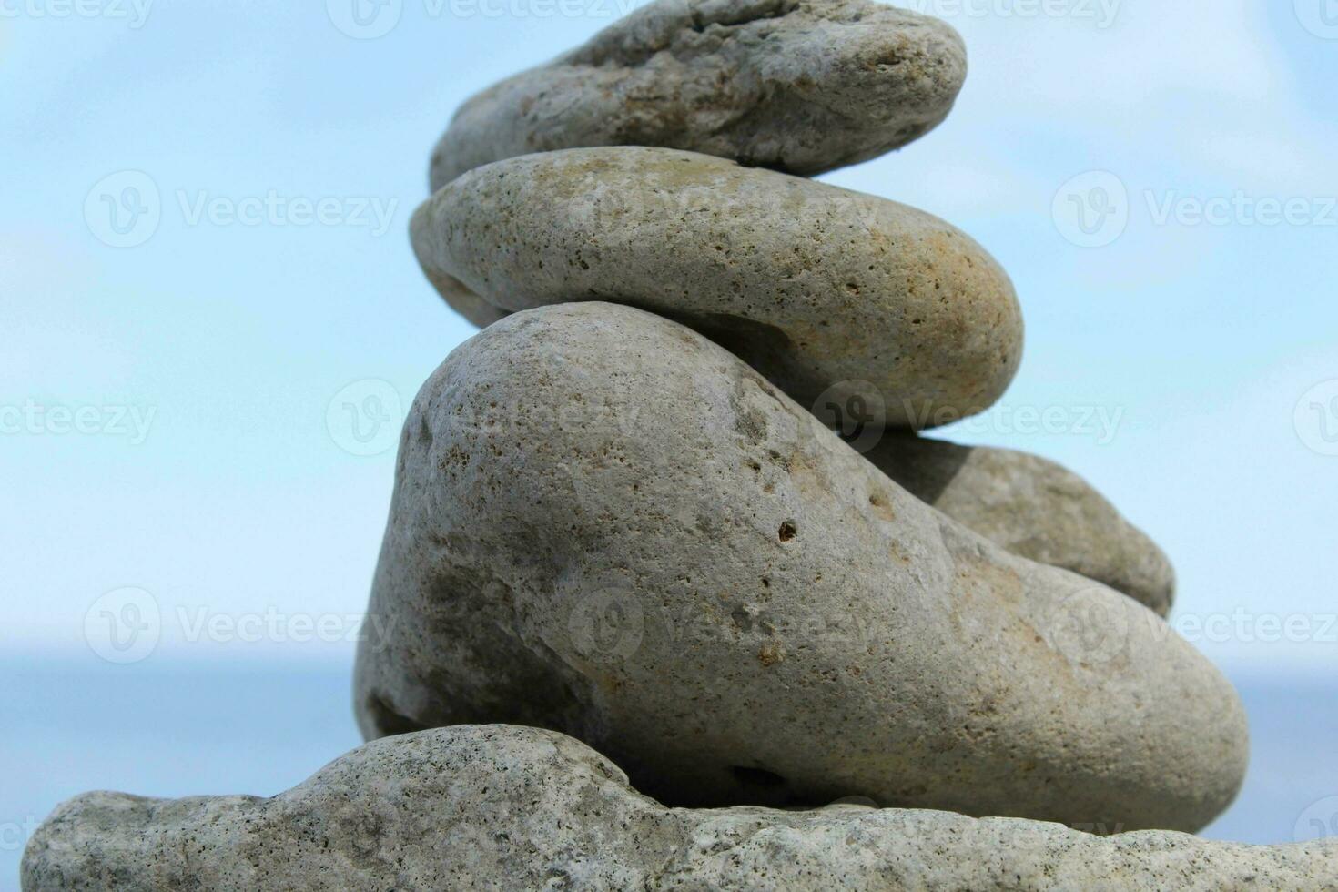 Rocks Stacked one on top of another on the background of the sea photo