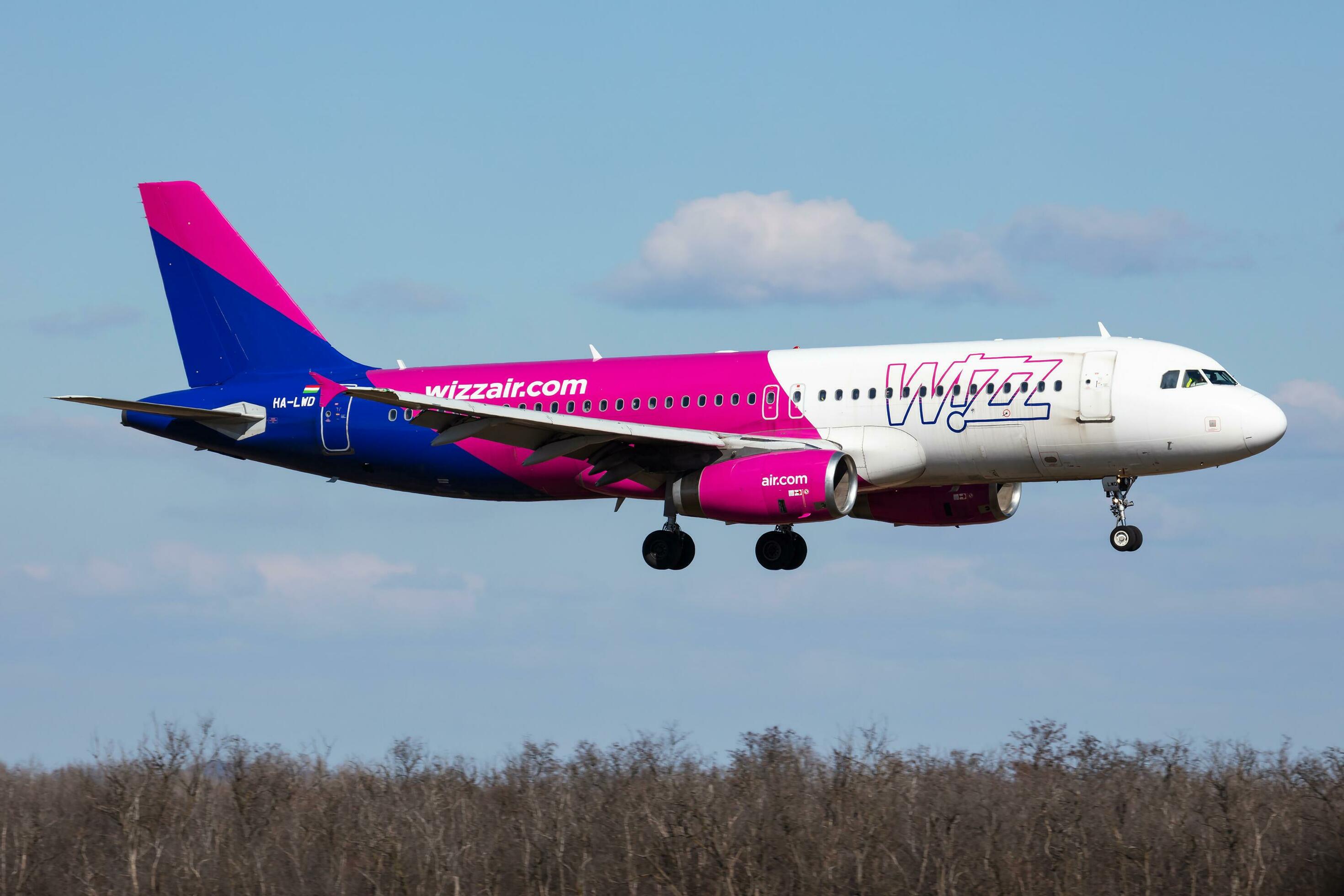 Wizz Air passenger plane at airport. Schedule flight travel. Aviation