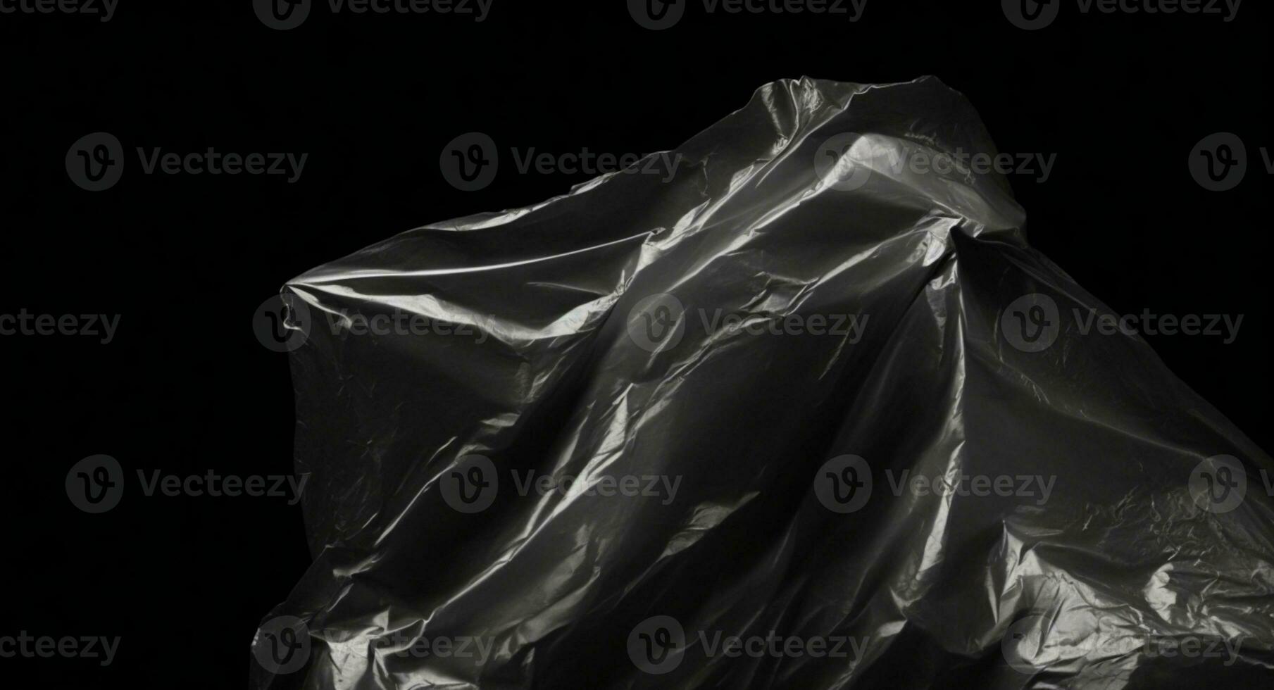 Wrinkled plastic wrap texture on a black background. AI generated photo