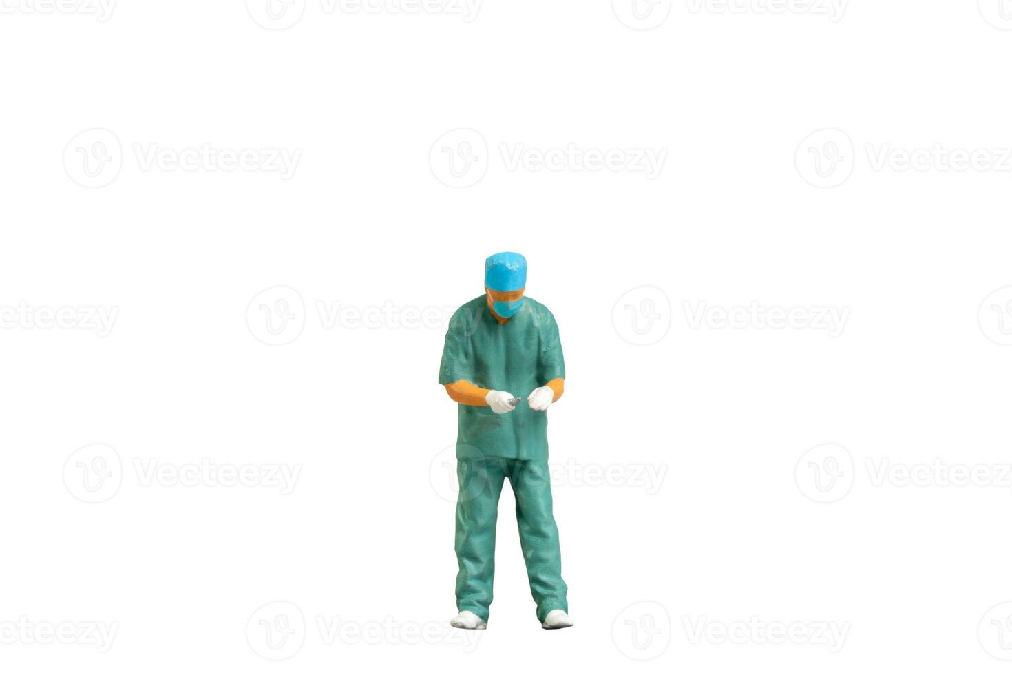 Miniature people young doctor in scrubs Isolated on white background with clipping path photo