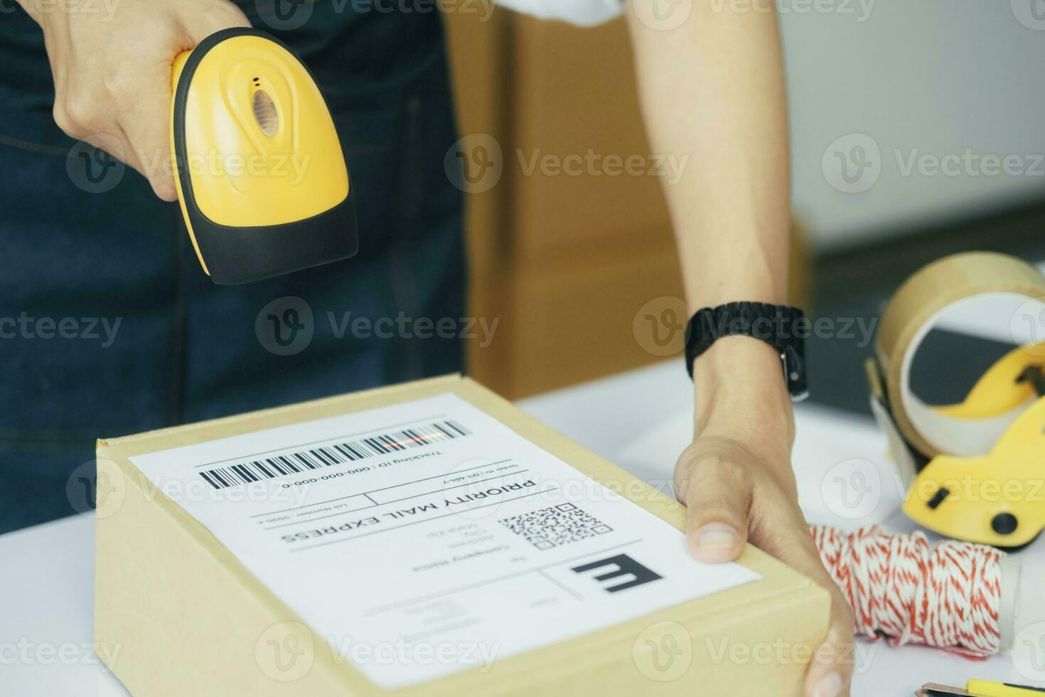 Scanning parcel barcode before shipment. photo