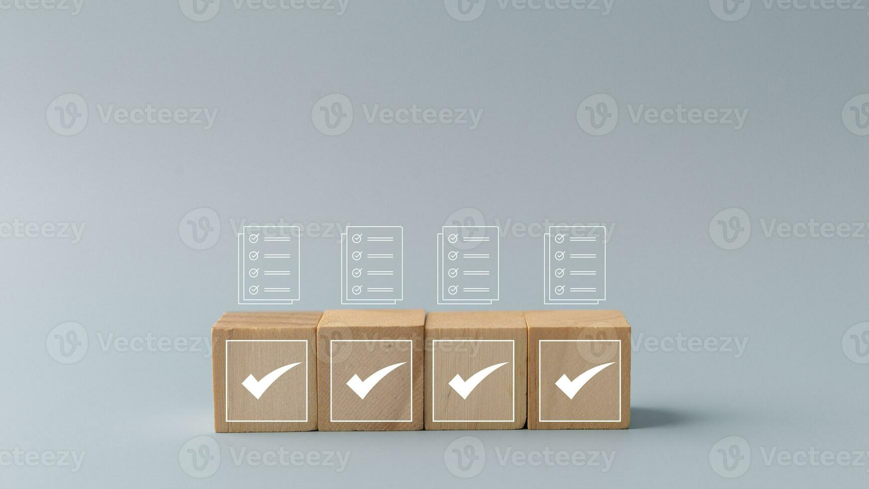 Wooden cubes with check box icon. Assessment, questionnaire, evaluation, online survey online exam choose the right answer in the exam, filling out an online survey form. photo