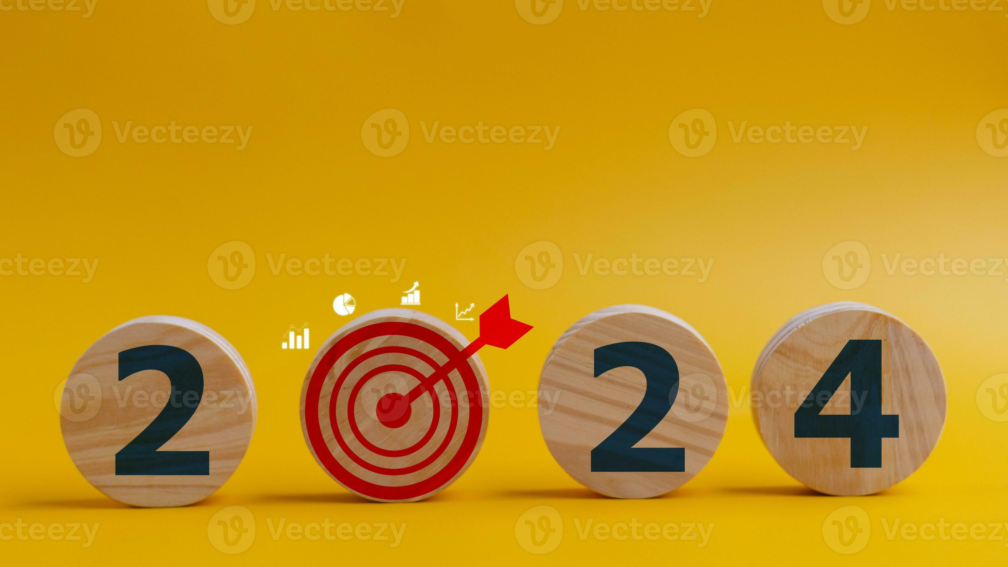 2024 goals of business or life. Wooden circles with 2024 and goal icons
