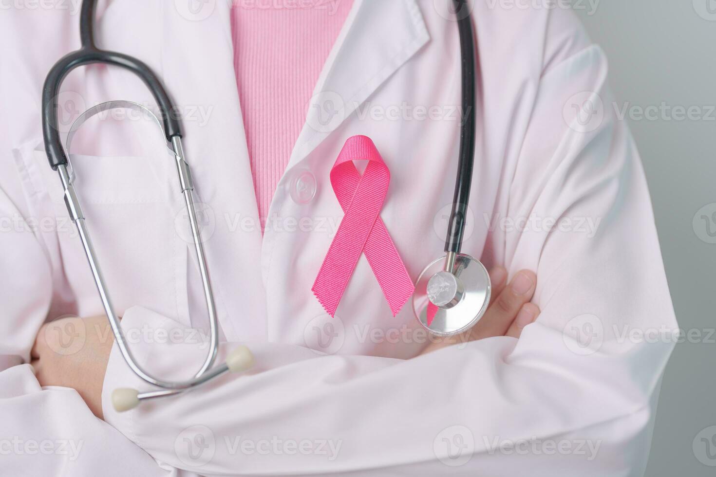 Pink October Breast Cancer Awareness month, doctor with pink Ribbon in hospital for support people life and illness. National cancer survivors month, Mother and World cancer day concept photo