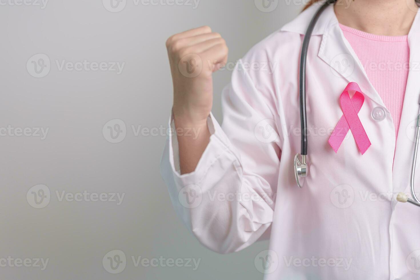 Pink October Breast Cancer Awareness month, doctor with pink Ribbon in hospital for support people life and illness. National cancer survivors month, Mother and World cancer day concept photo