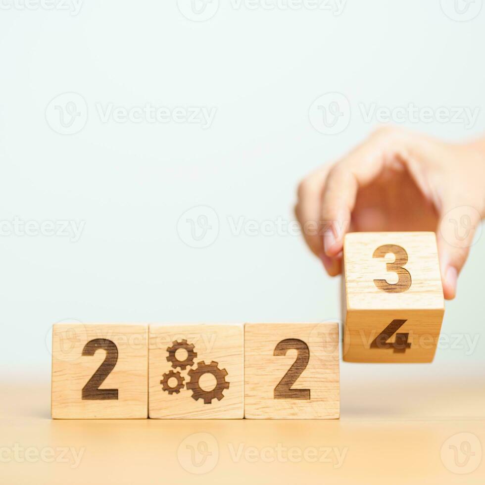 2024 block with gear icon. Business Process, Team, teamwork, Goal, Target, Resolution, strategy, plan, Action, motivation, change, brainstorm and New Year start concepts photo