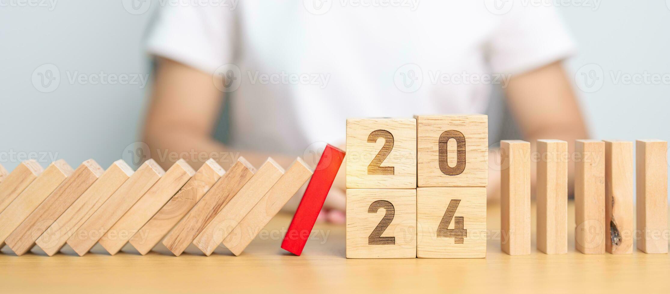 2024 year with falling blocks on table, Risk Management, recession, business financial, Resolution, strategy, goal, New Year planning and inflation economy concepts photo