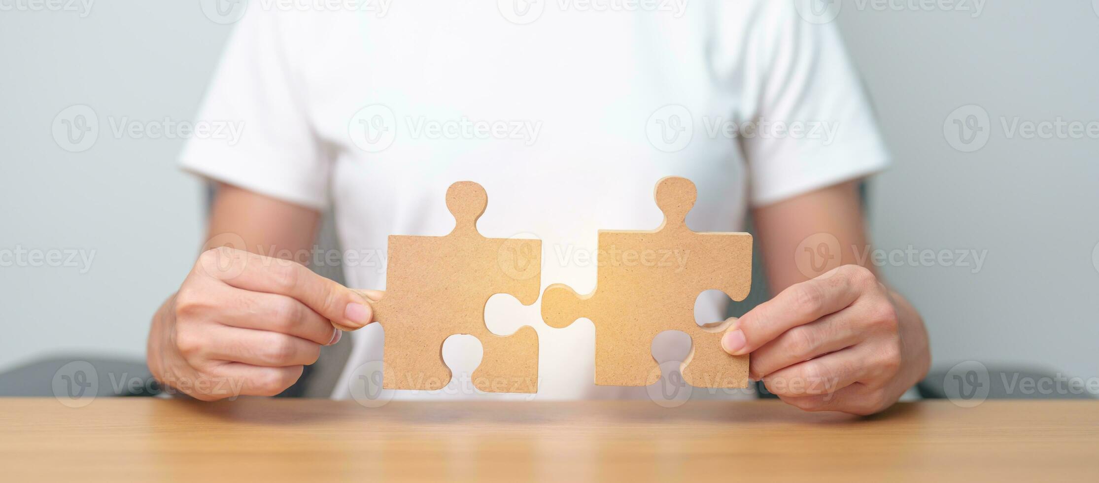 Hand connecting couple puzzle piece. Business Solving, mission, challenge, success, goals, target and strategy concepts photo