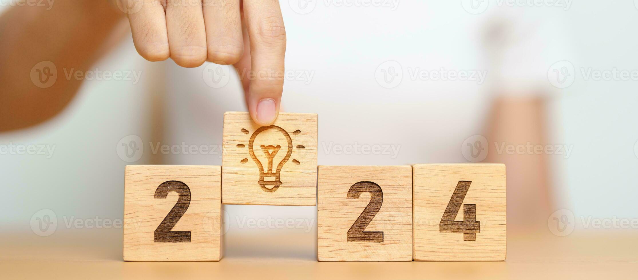 2024 block with lightbulb. Business Idea, Creative, Thinking, brainstorm, Goal, Resolution, strategy, plan, Action, change and New Year start concepts photo