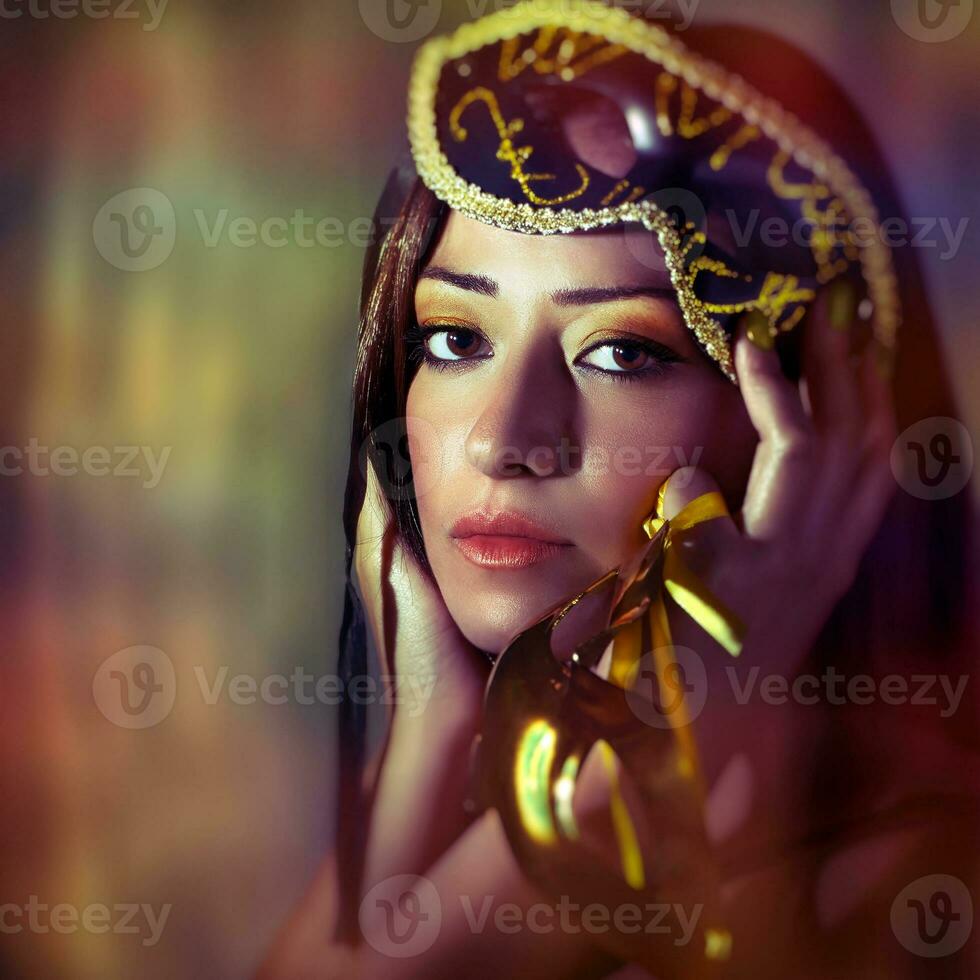 Woman wearing venetian mask photo