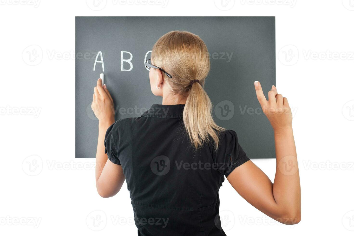 Young teacher near blackboard photo