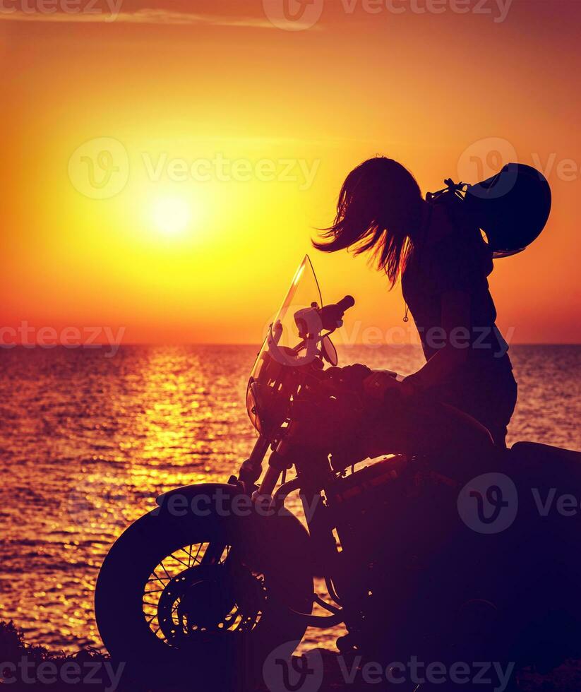 Silhouette of a biker woman photo