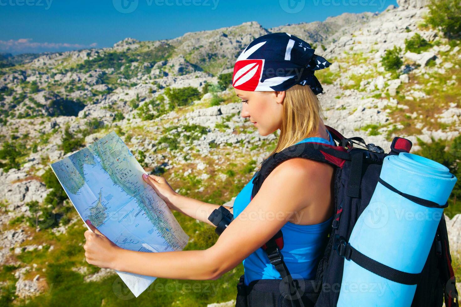 Traveling woman looking in map photo