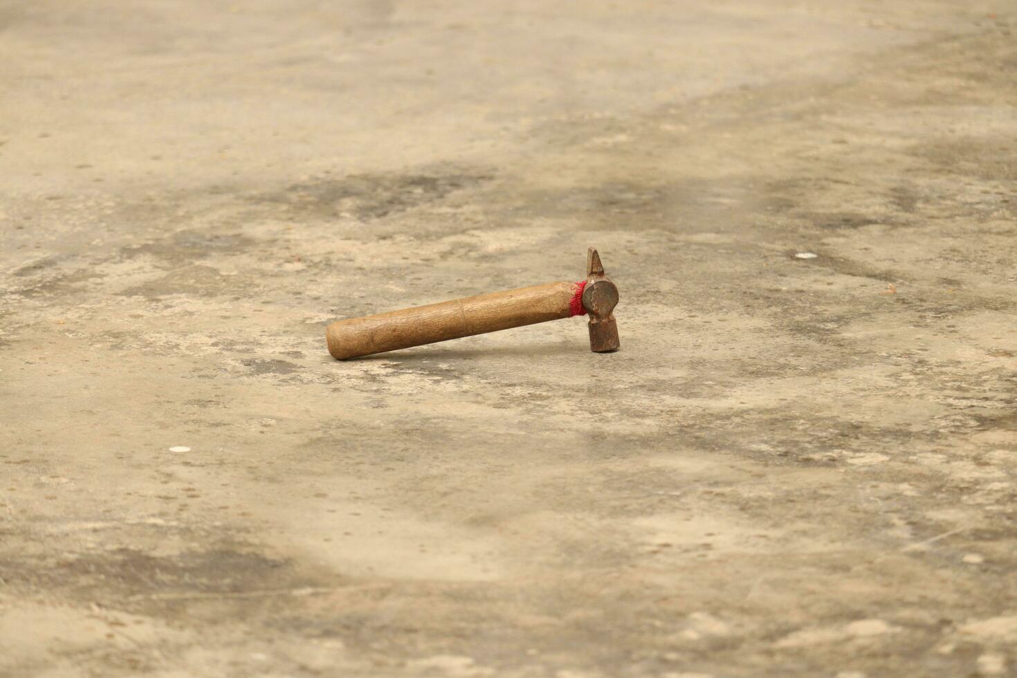 A hammer on the floor photo