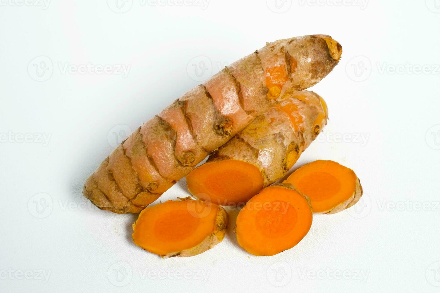 Turmeric rhizome kunyit on the white background photo