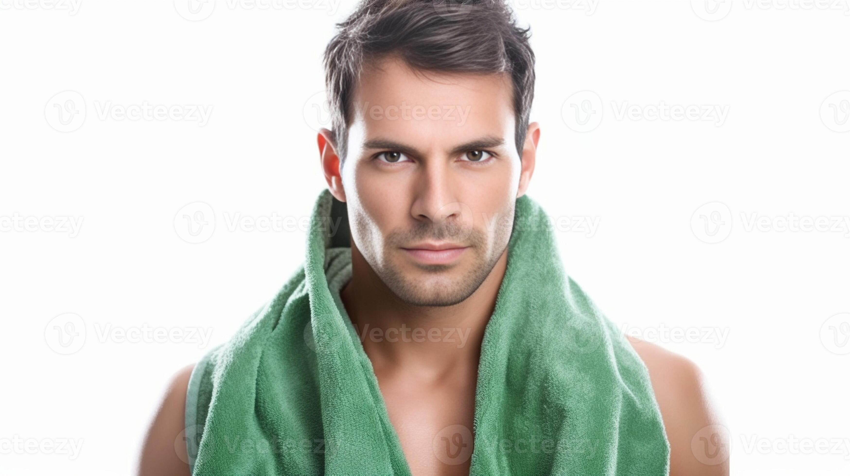 Everyday routine Handsome young man wiping his face with towel while