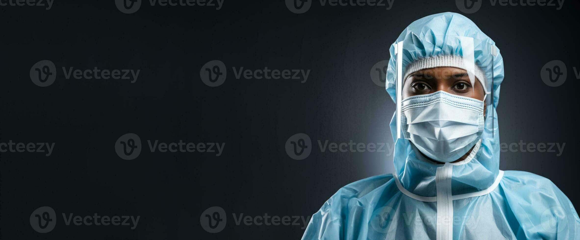 Medical specialist donning a PPE suit isolated on a gradient white background photo