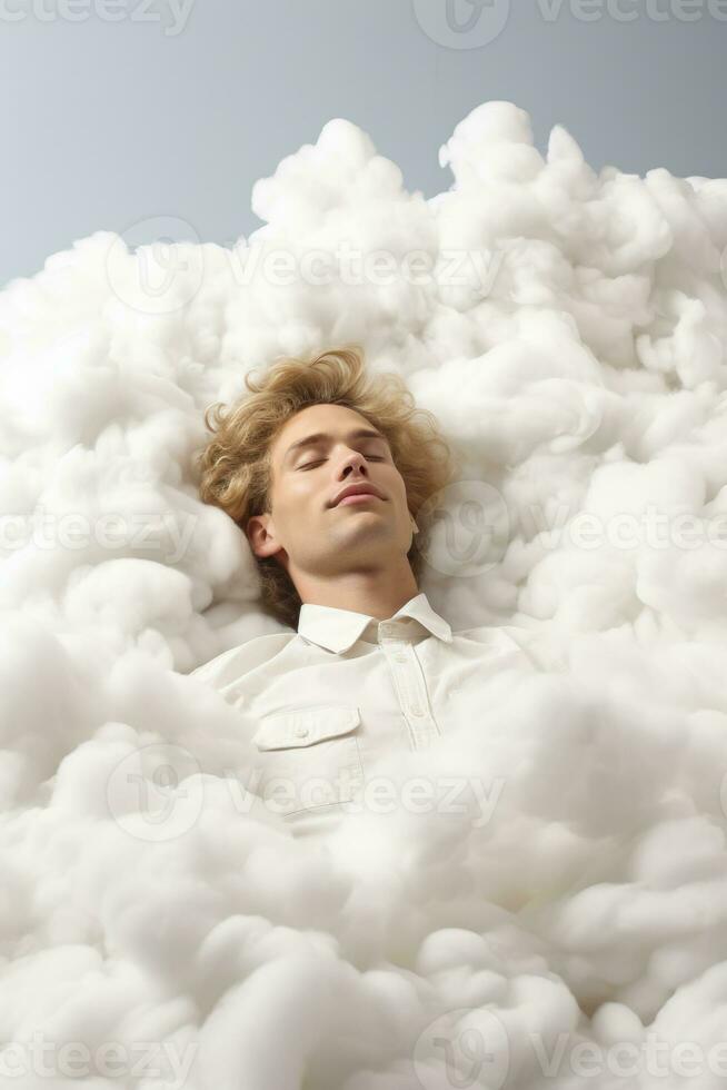 Surreal artist laying on a fluffy cloud isolated on a white background photo