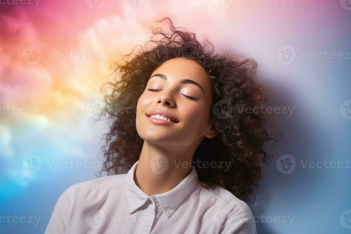 A teen dozing on a dreamy cloud isolated on a rainbow gradient background photo