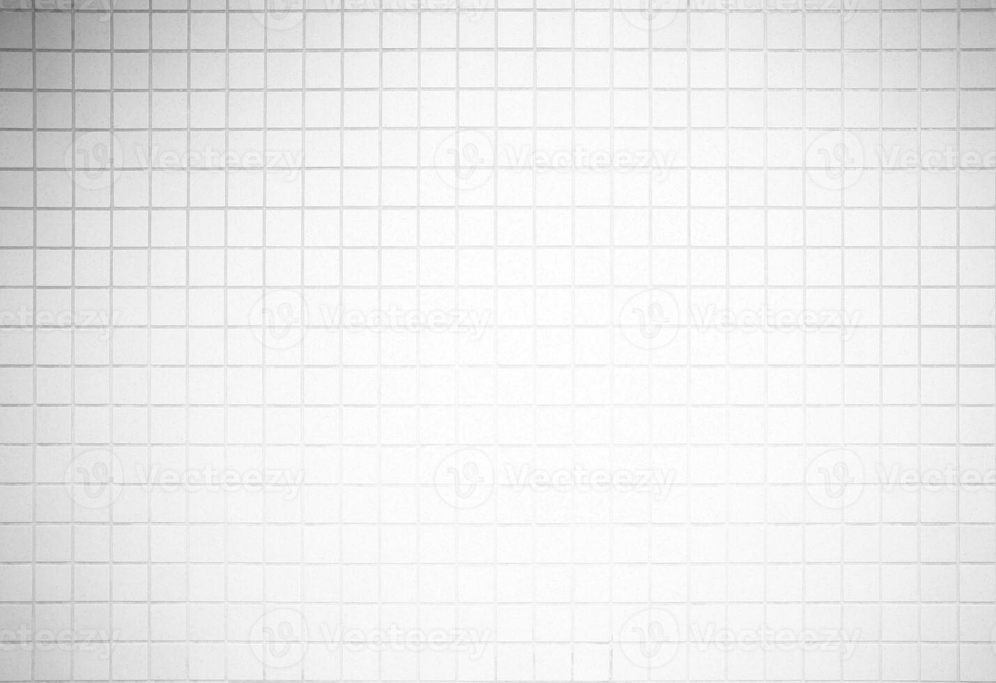 White Mosaic Tiles Toilet Wall with Light Leak from the Top. photo