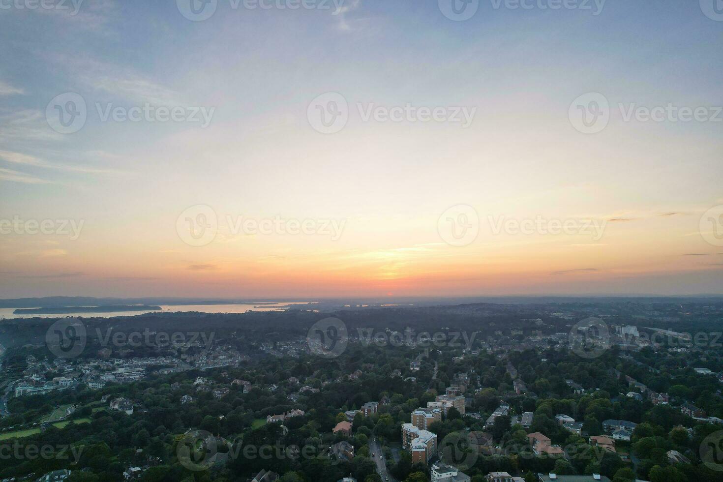 Beautiful Aerial Footage of British Tourist Attraction at Sea View of Bournemouth City of England Great Britain UK. High Angle Image Captured with Drone's Camera on September 9th, 2023 During Sunset photo