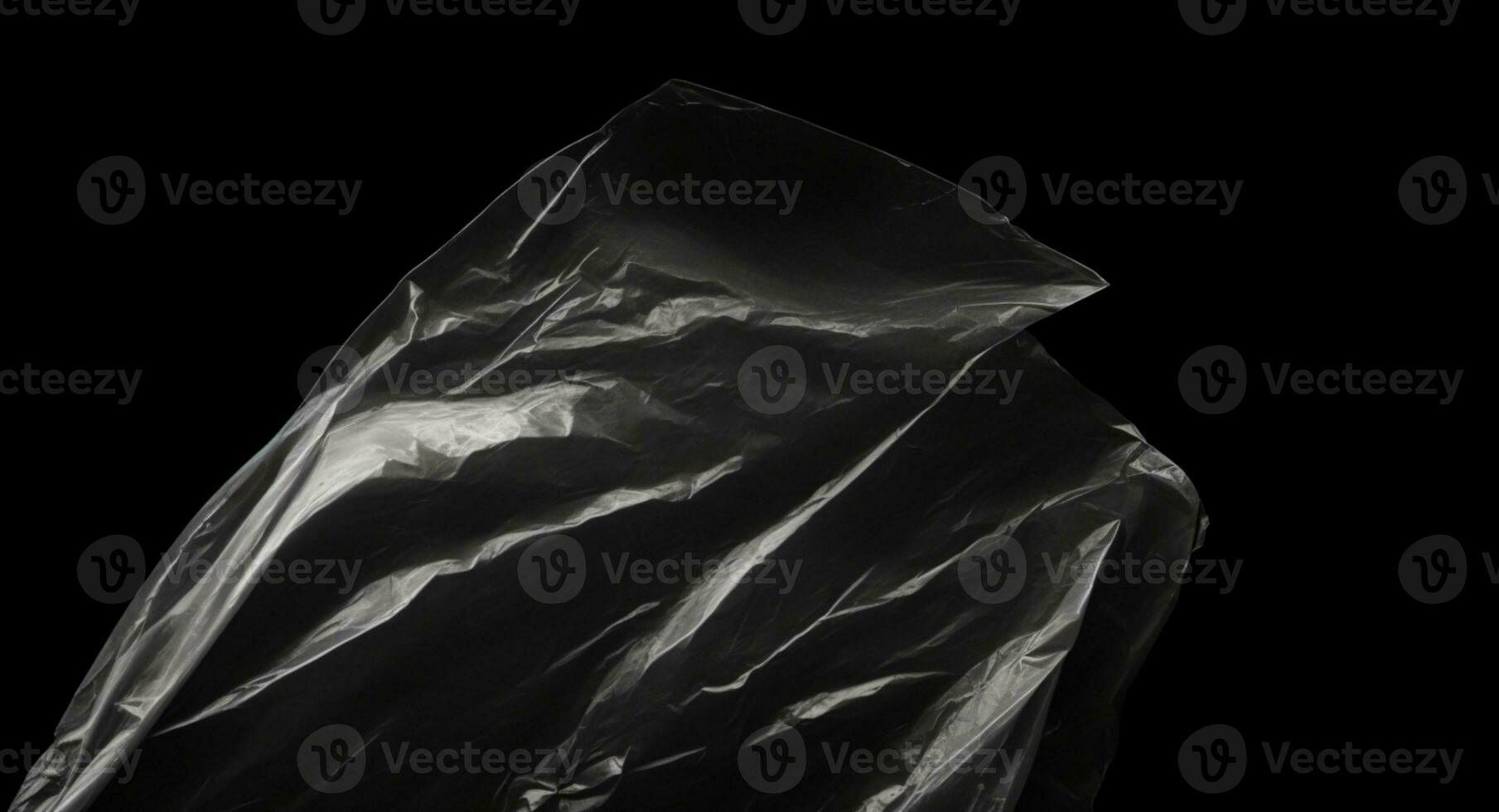 Wrinkled plastic wrap texture on a black background. AI generated photo