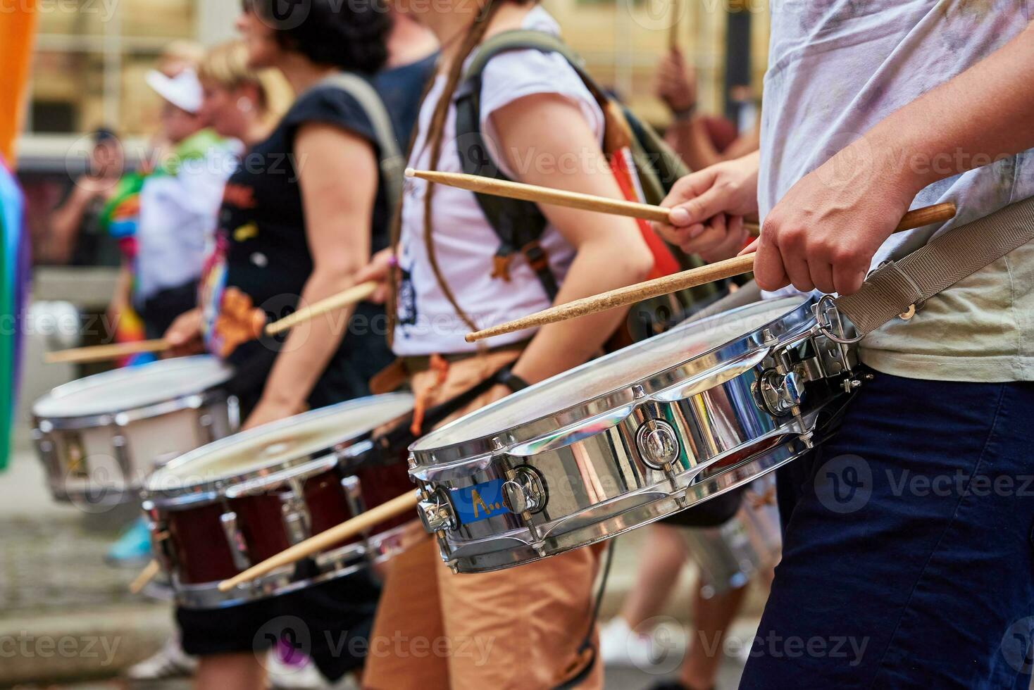 People with drums in street at demonstration in city photo
