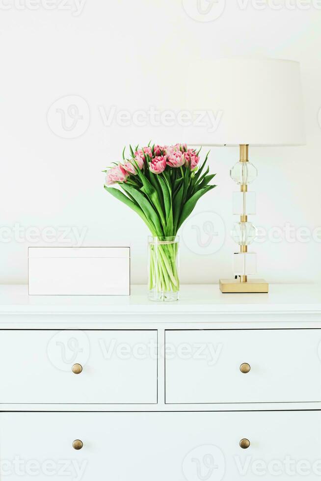 Bouquet of flowers in vase and home decor details, luxury interior design photo