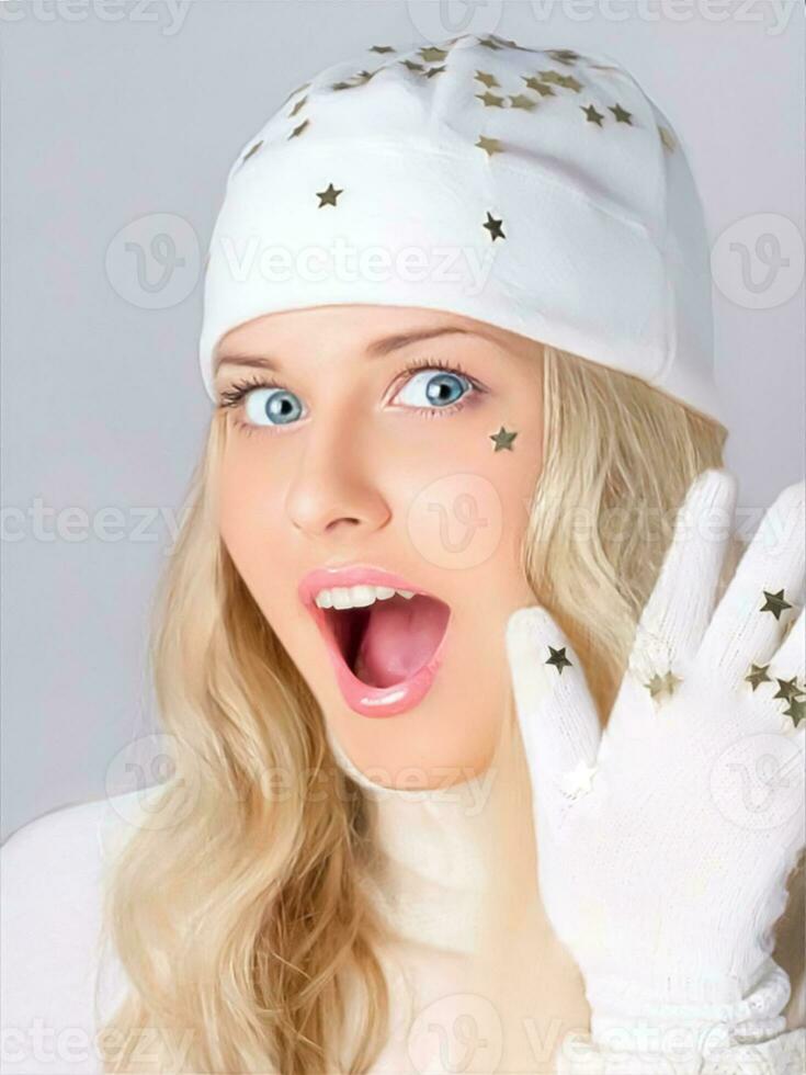 Merry Christmas, holidays and woman dressed in white hat and gloves. On studio background, beauty and fashion female model. Surprised blonde girl smiles, Christmas and winter holiday lifestyle photo