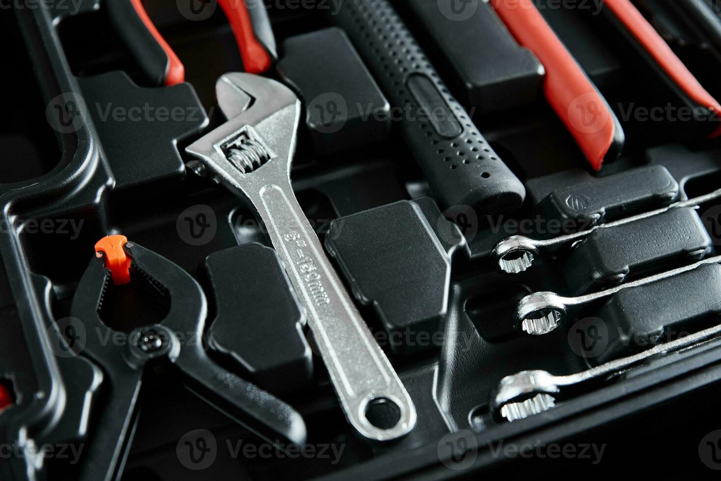 Set of tools for repair and maintenance on black background photo