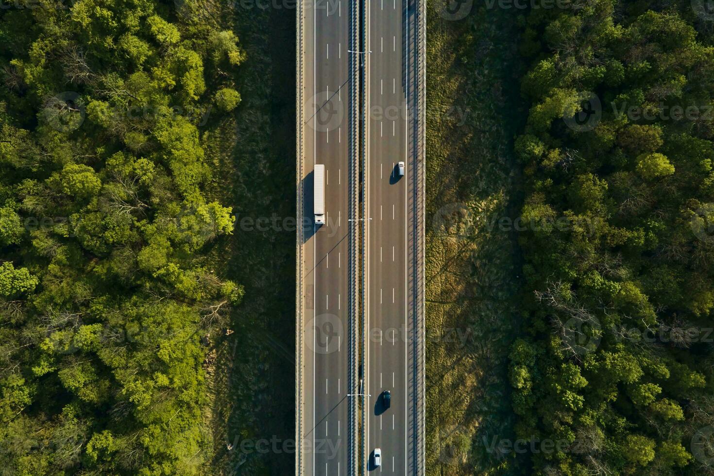 Aerial view of highway road with moving cars photo