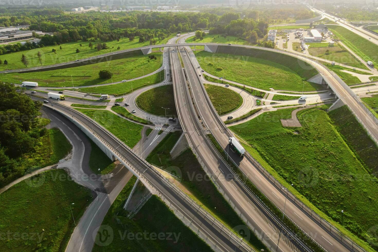 Cars moving on transport road junction in city, aerial view photo