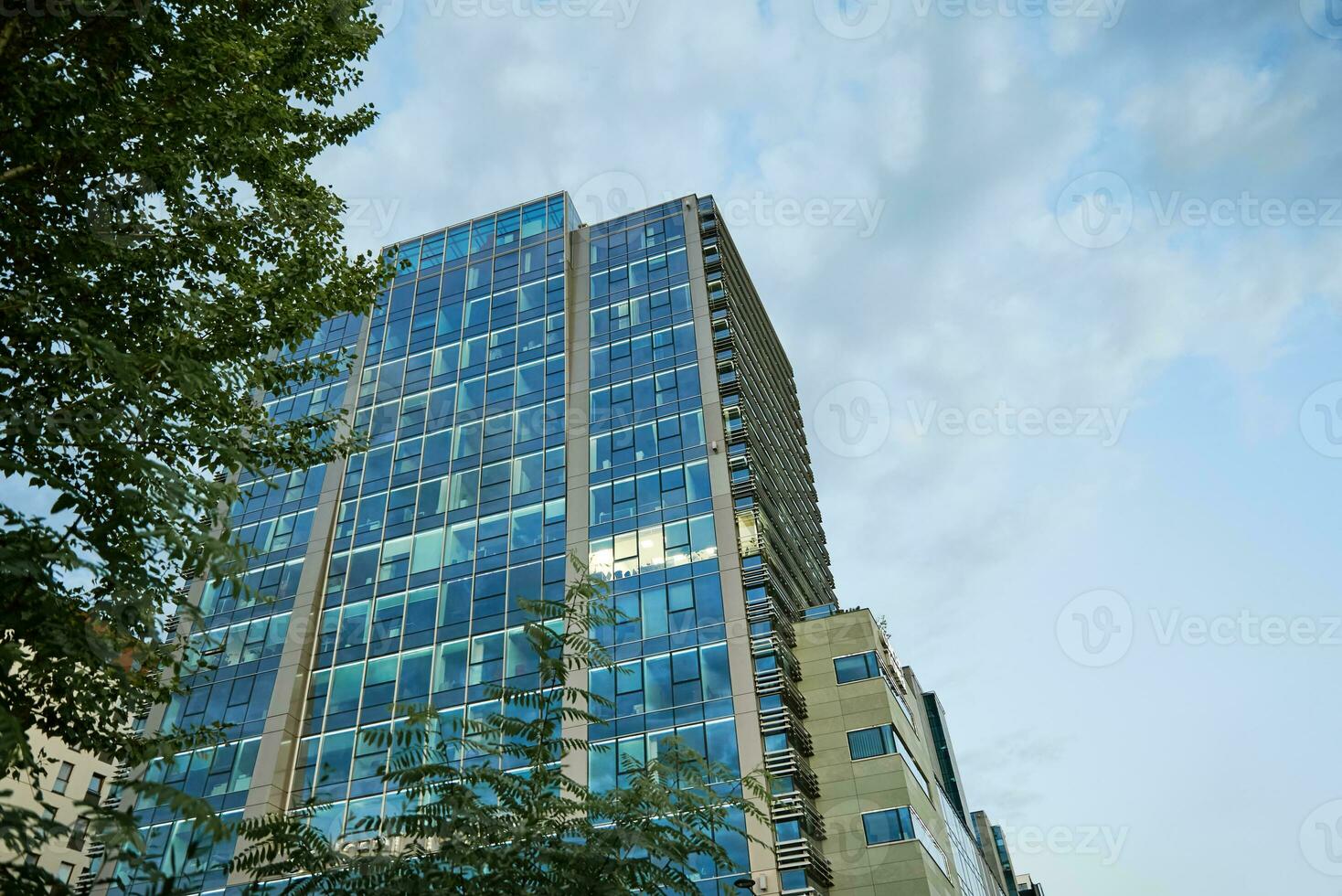 Glass facade of modern building in city, modern european architecture photo
