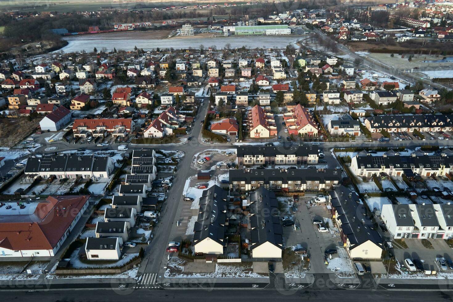 Aerial drone view of residential neighborhood in winter season photo