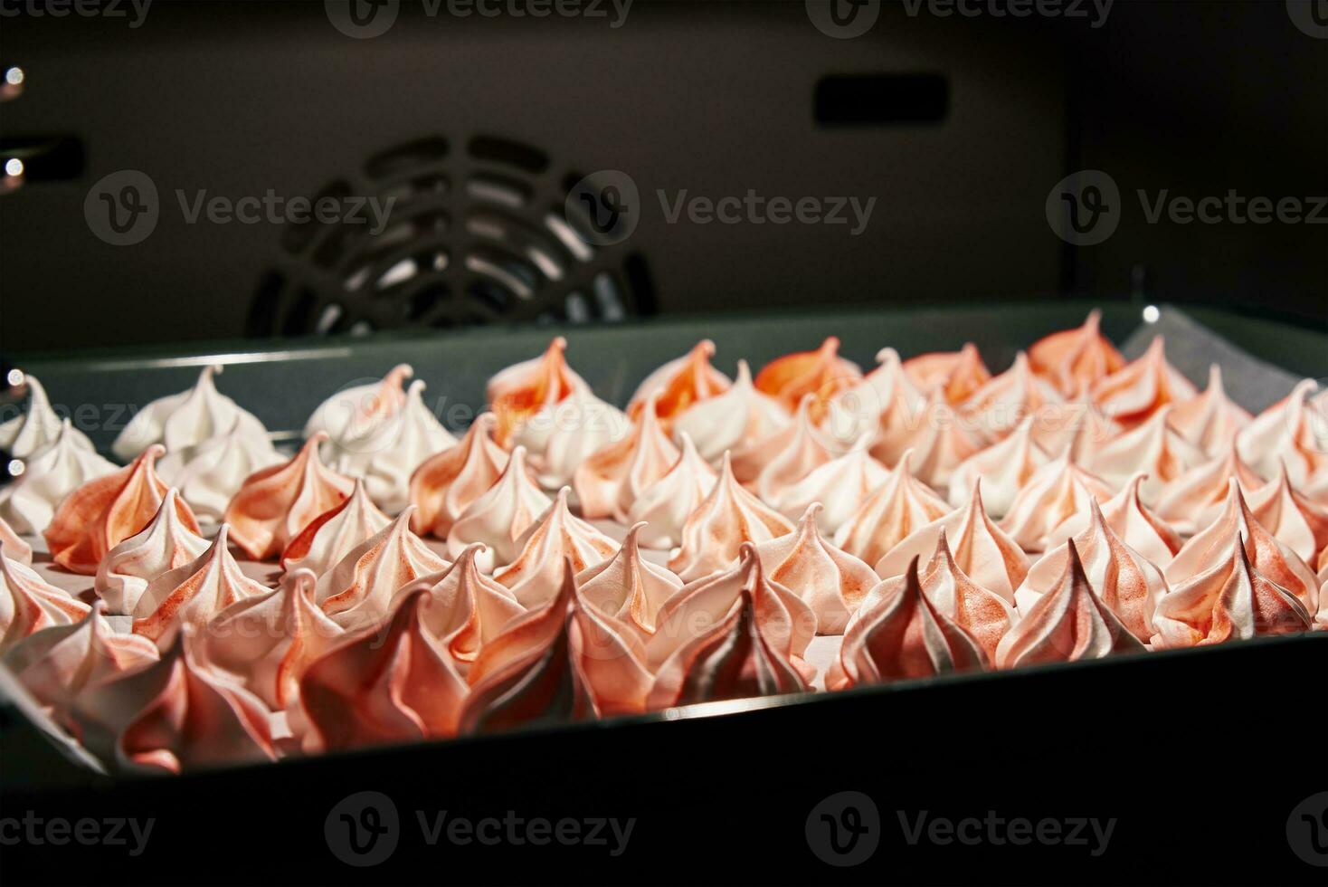 Process of baking meringue in oven, Cooking sweet dessert photo