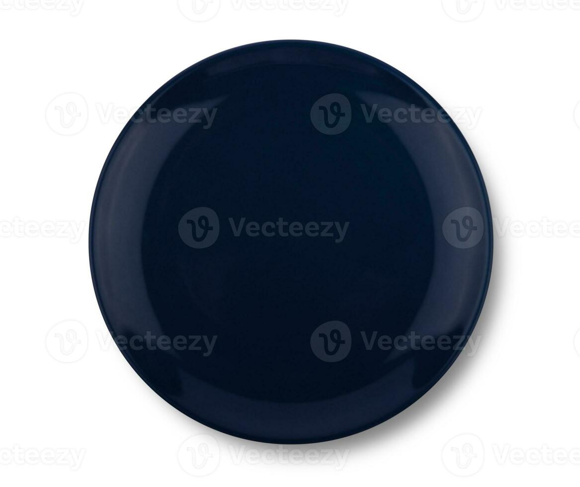 Dark blue plate isolated on white background. photo